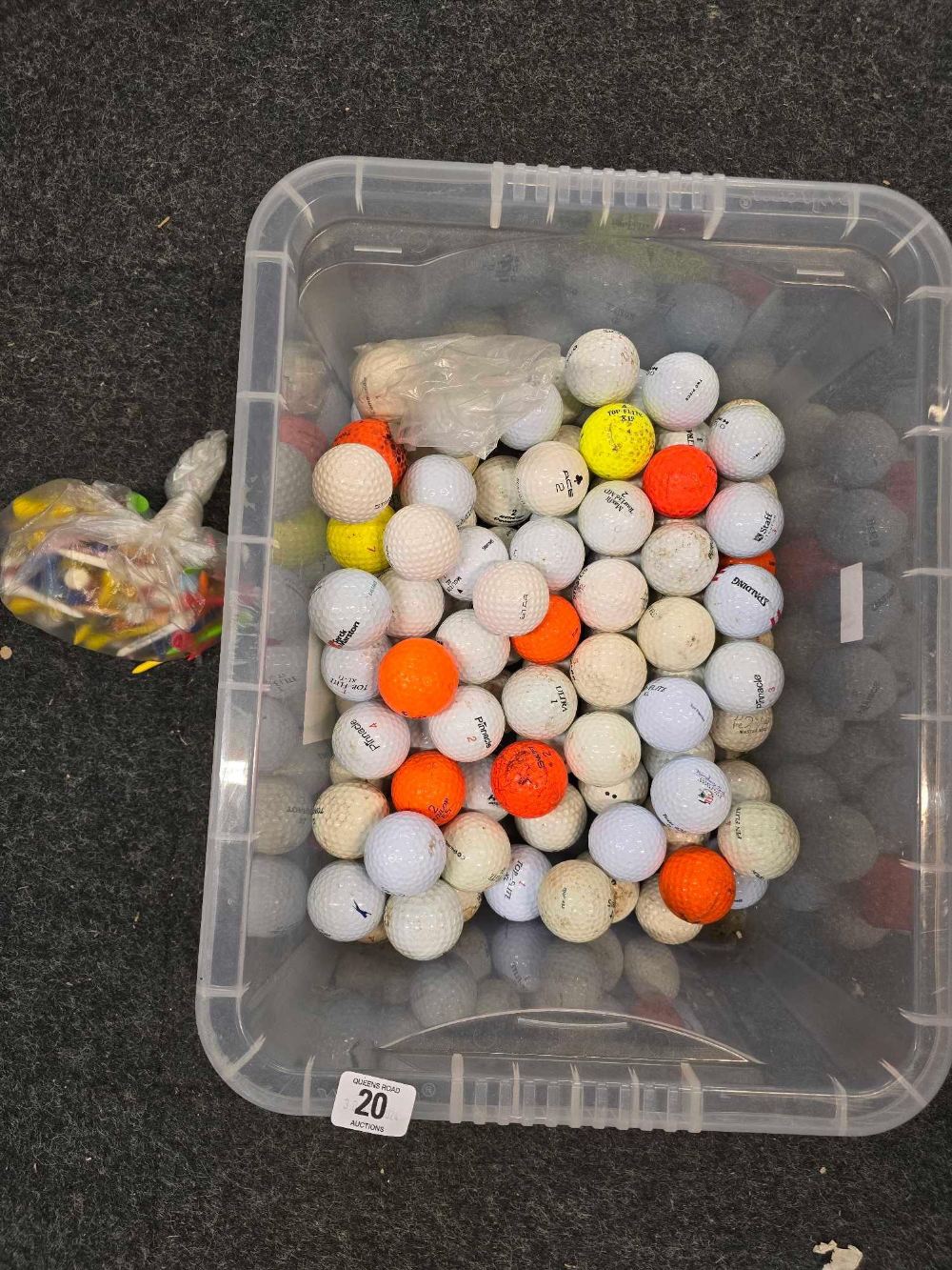 PLASTIC CARTON OF USED GOLF BALLS