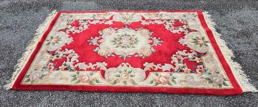 74" X 48" RED PATTERNED RUG