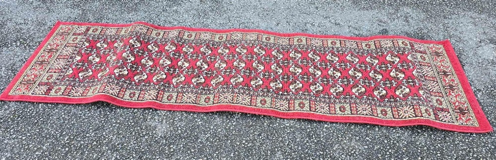 88" X 24" RED PATTERNED RUG