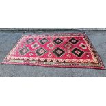 115" X 60" RED PATTERNED CARPET