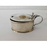 AN OVAL SILVER MUSTARD POT WITH B.G.