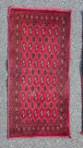 PAIR OF RED RUGS 45" X 22"