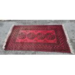 70" X 40" RED PATTERNED RUG