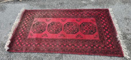 70" X 40" RED PATTERNED RUG