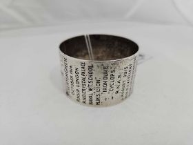 A ROYAL NAVY SILVER NAPKIN RING ENGRAVED WITH FOLLOWING CAREER OF R.