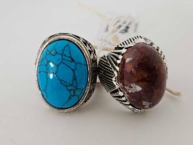 2 LARGE SILVER COLOURED STONE SET GENTS RINGS