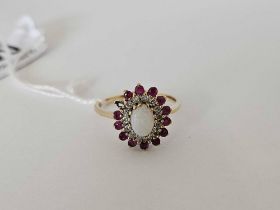 AN OPAL OVAL CLUSTER RING WITH DIAMOND & RUBY BORDER IN GOLD,