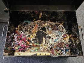 TIN BOX OF COSTUME JEWELLERY