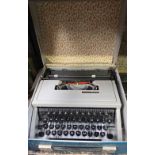 OLIVETTI DORA PORTABLE TYPEWRITER IN CASE,