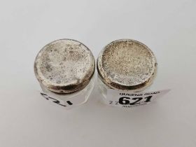 A SMALL PAIR OF SILVER TOP JARS,
