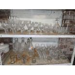 2 SHELVES OF MISC DRINKING GLASSES & DECANTERS