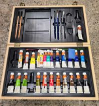 AN ARTISTS WOODEN WATERCOLOUR PAINT BOX