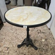 ROUND TEA TABLE ON CAST IRON STAND,