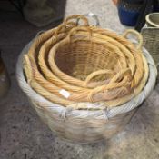 GRADUATED SET OF WICKER CANE BASKETS, LARGEST 25'' DIA APPROX