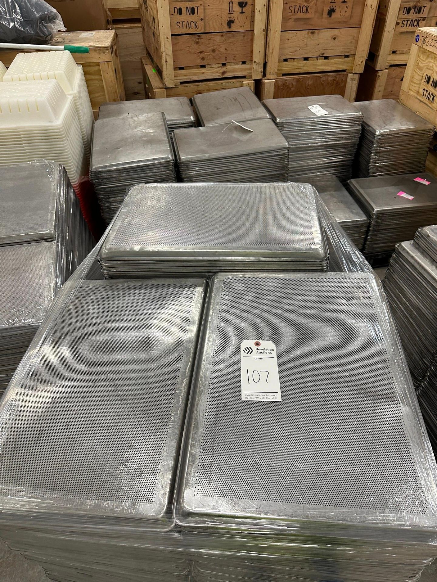 SKID OF PERFORATED METAL FOOD TRAYS