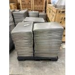 SKID OF PERFORATED METAL FOOD TRAYS