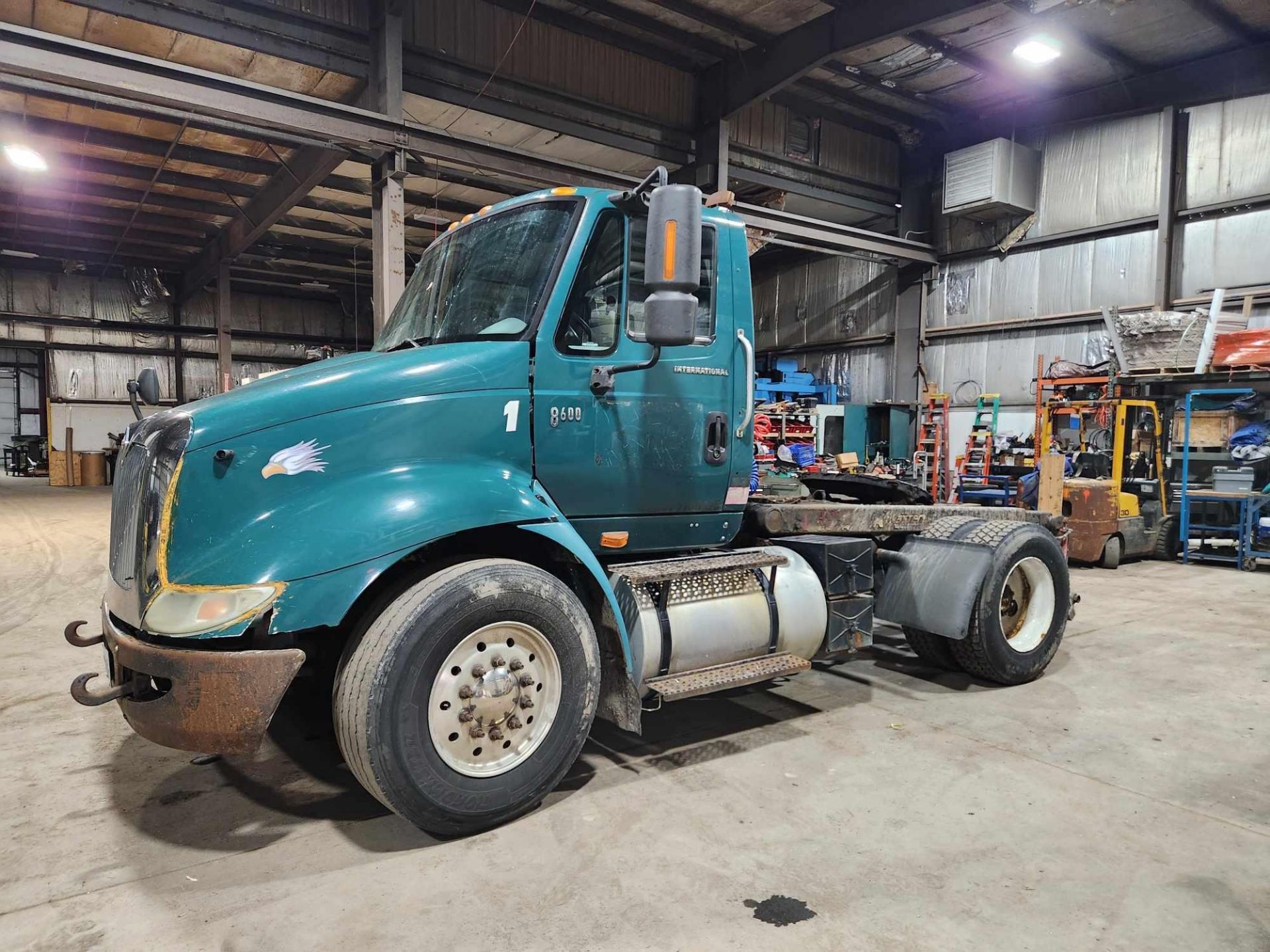 INTERNATIONAL 8600 WITH CAT 13 ENGINE AND FORK ATTACHMENT