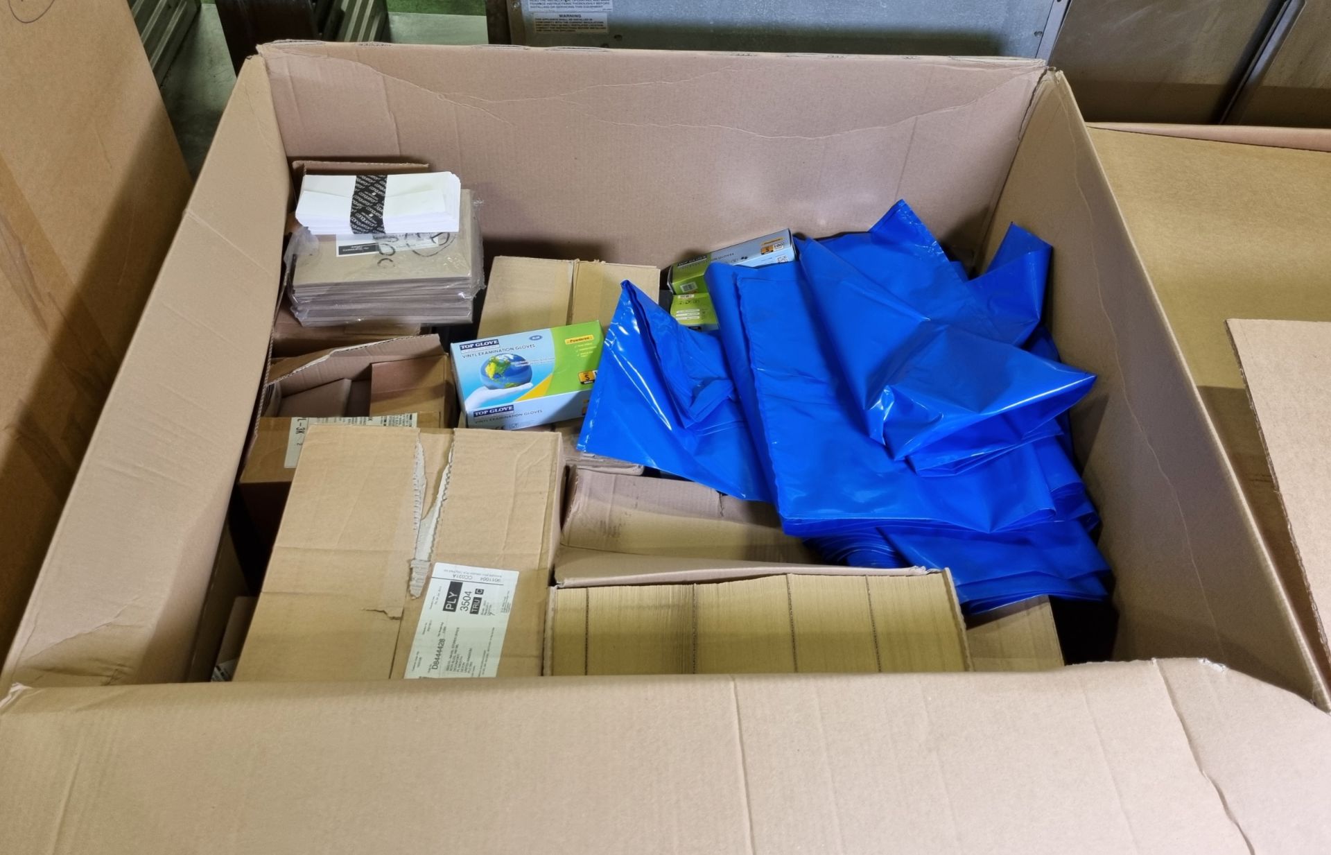 Office stationery supplies - brown / white envelopes, vinyl rubber gloves and blue plastic waste bag