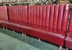 Red leather padded bench seating
