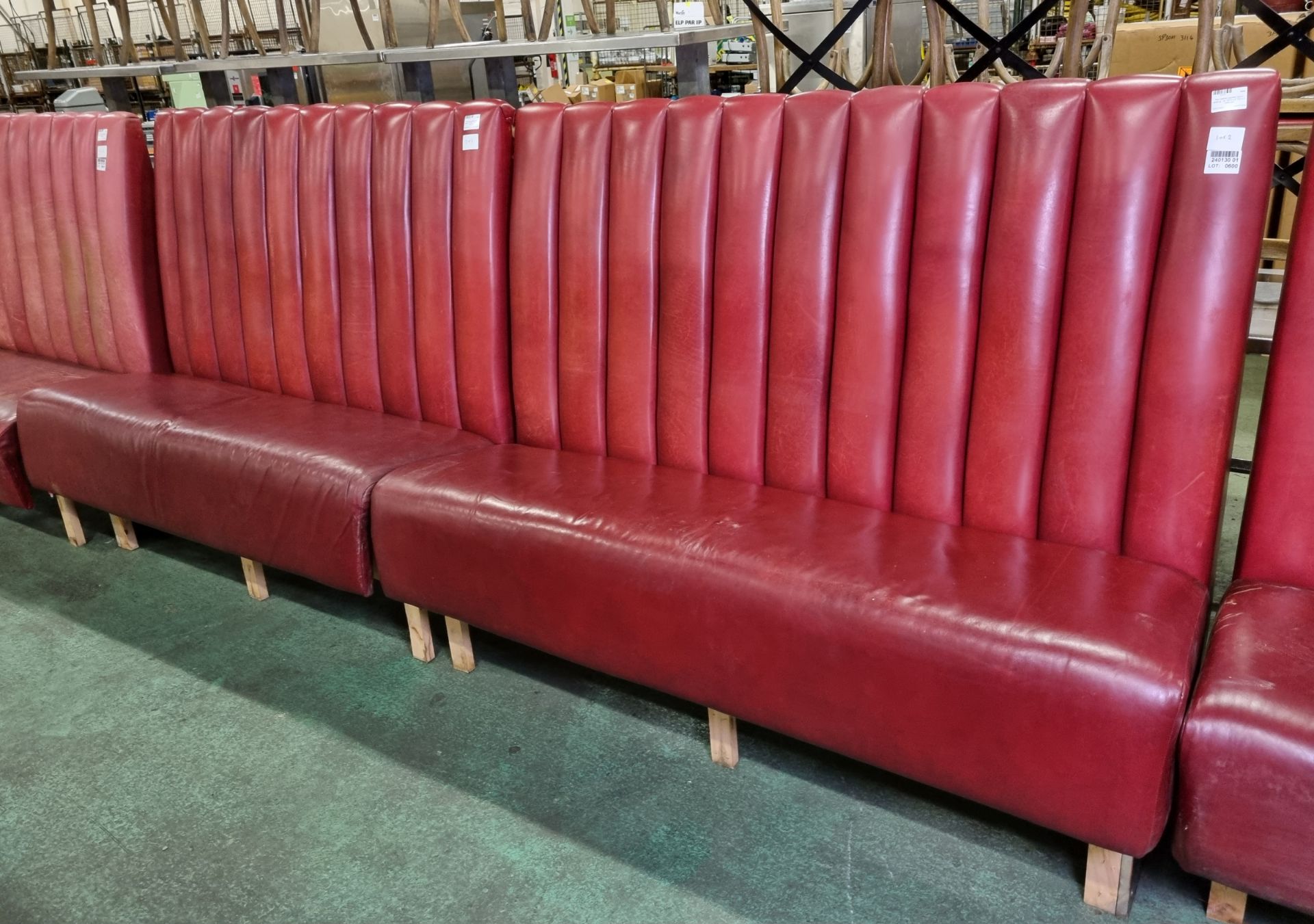 Red leather padded bench seating