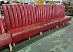 Red leather padded bench seating