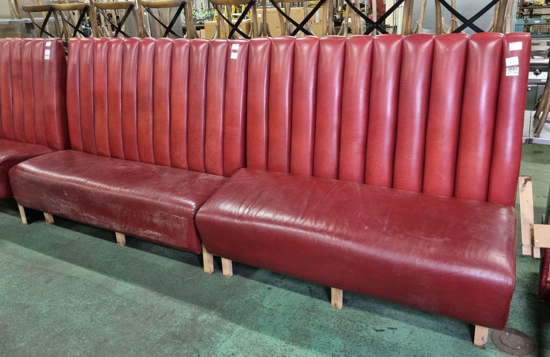 Red leather padded bench seating