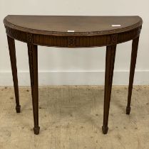 A demi-lune mahogany console table in the Neoclassical taste, early 20th century, floral carved