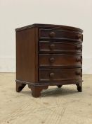 A Victorian style stained hardwood miniature table top chest, fitted with four graduated drawers.
