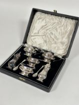 A Epns six piece octagonal baluster condiment set comprising, pair of pepperettes, pair of