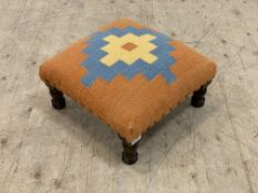 A Victorian style stained hardwood footstool, the top upholstered in kilim style wool fabric, in