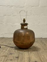 A decorative planished copper lamp base H45cm