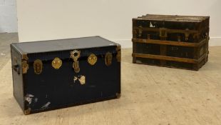 Two large bound cabin trunks with bound corners and handles to side. (2)