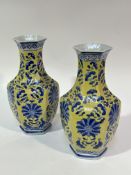 A pair of modern octagonal baluster paneled vases with blue floral and leaf all over design, (H x 26