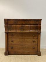 A Victorian mahogany two part chest, the top section fitted with a frieze drawer and three bolection