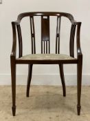 An Edwardian inlaid mahogany elbow chair, the swept crest rail and arm rests on spar gallery,