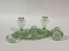 A 1930's Bagley Rutland art deco green glass part vanity set comprising a pair of candle sticks (h-