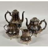 An Edwardian Epns panel sided baluster four piece tea service including, tea and coffee pots, two