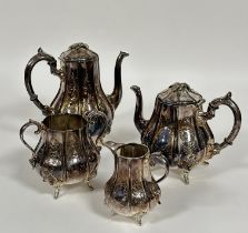 An Edwardian Epns panel sided baluster four piece tea service including, tea and coffee pots, two