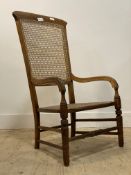A late Victorian beech framed cane panel back and seat arm chair on turned tapered supports. H101cm
