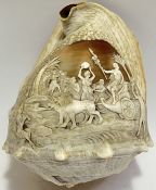 A large cameo shell carved with classical design of charioteer with lions and figures including Pan