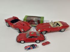 A Burago red Jaguar E type soft top die cast 1/18 model car, a red Ferrari 250 Testa Rossa 1957