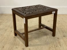 An Eastern hardwood end table, the top pierce carved with vining leaves and foliate, raised on
