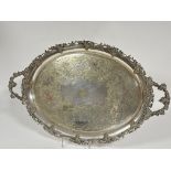 A substantial Edwardian Epns oval twin handled drinks tray with cast vine leaf and fruit border, the