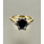 A 18ct gold solitaire sapphire ring in diamond point six claw setting,  approximately 0.5ct, L.  3.
