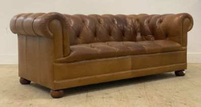 Laura Ashley, A traditional two seat Chesterfield sofa, well upholstered in deep buttoned tan