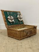 A vintage Wicker picnic hamper by 'Optimus' the fitted interior complete with flat ware, Tupperware,