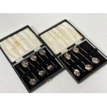 Two boxed sets of Sheffield silver bean handled coffee spoons, show little to no signs of use,