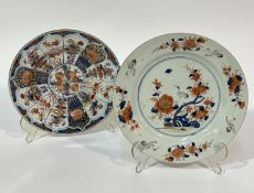 A Japanese porcelain circular plate decorated in traditional Imari pomegranate design, small chip to