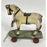 A early 20thc Folk Art style childs pine toy horse figure, with plaster coated finish raised on