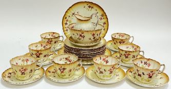 A Royal Albert Crown China part tea service comprising eight cups, nine saucers, nine trio/side plat